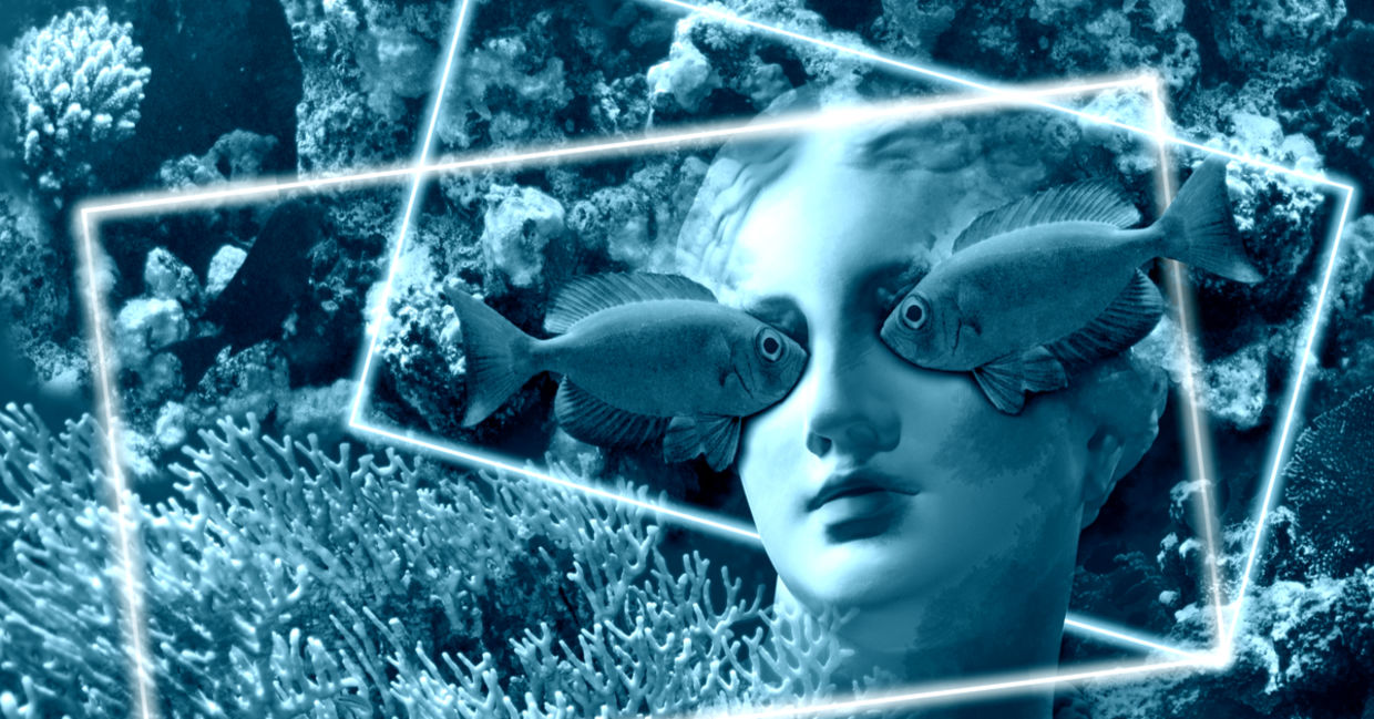 Face of ancient status on an underwater background with corals and fish
