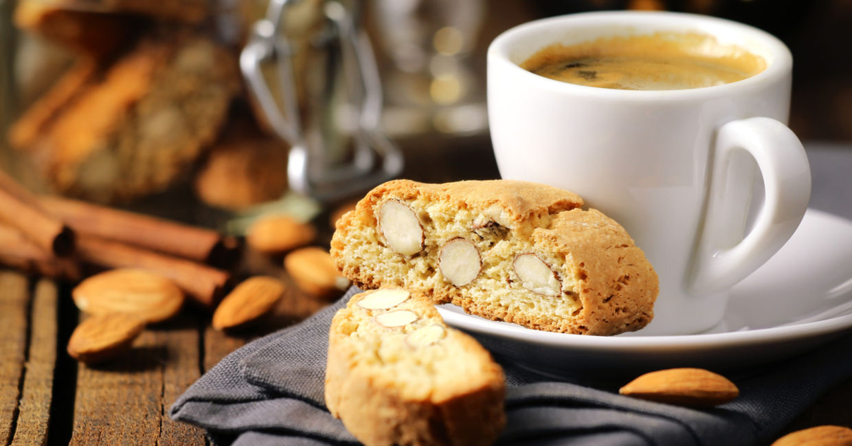 Frothy Italian espresso coffee with Italian almond biscuits.