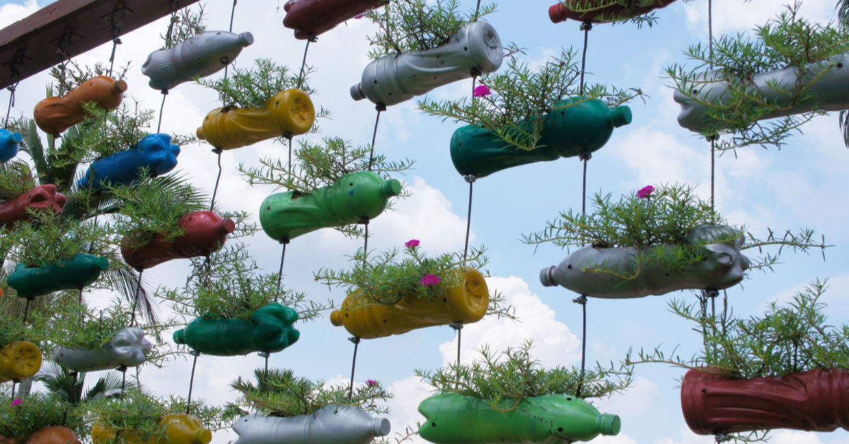 Recycled plastic gardens create a vertical garden.
