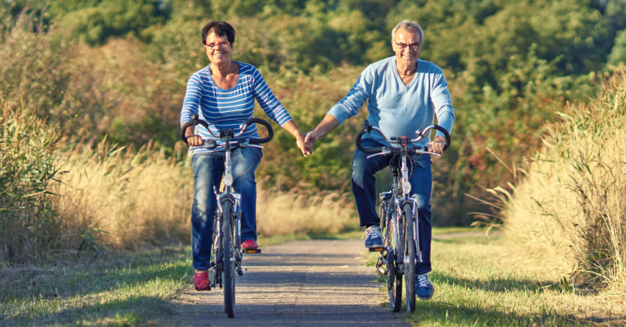 Biking outdoors like this couple is a great way to increase mitochondria.