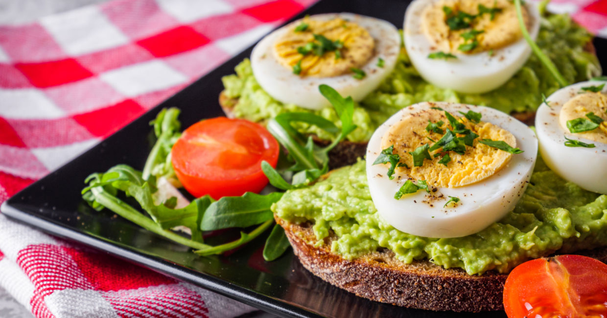 Serve mom avocado toast on a tray in bed.
