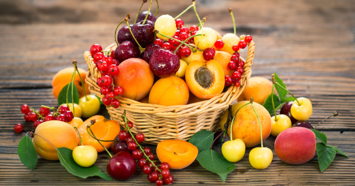 A basket full of summer fruit.