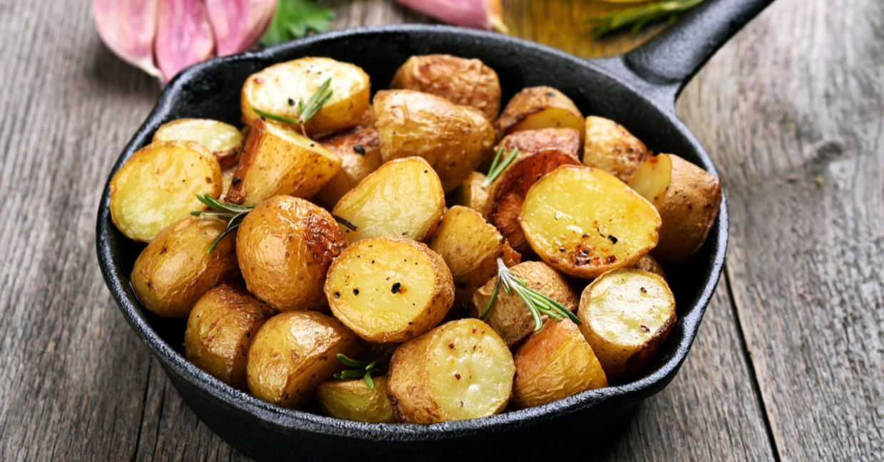 Roasted potatoes in cast iron cookware.