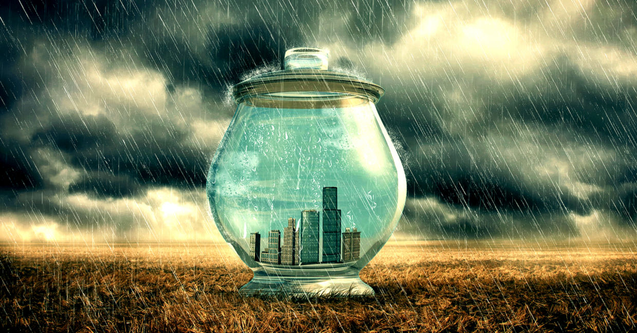 City buildings in a glass jar to emphasize protection from heavy rain.