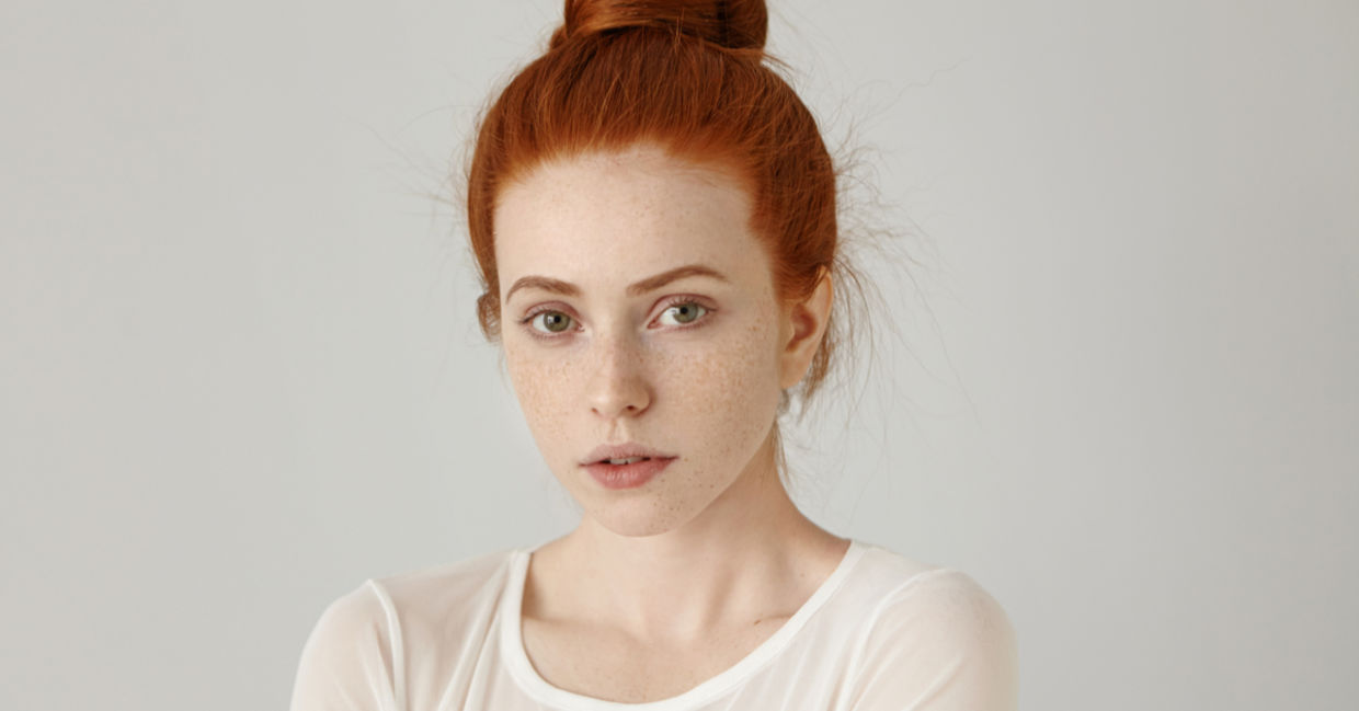 A portrait of a redhead woman.