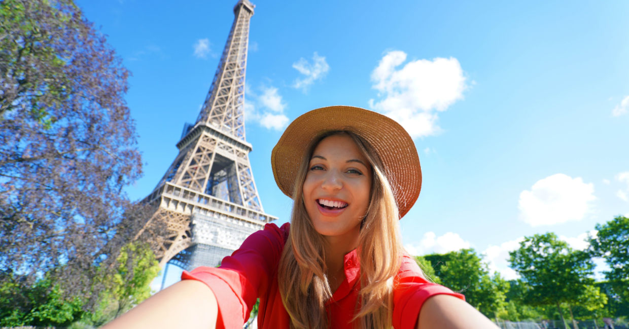 Tourist taking a selfie in Paris.