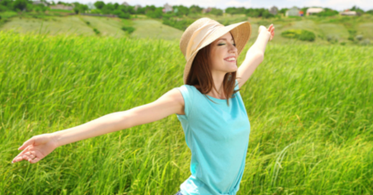 By being outdoors, a healthy woman is nurturing her skin microbiome.