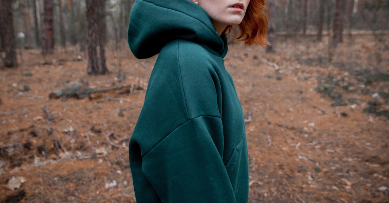 A woman wearing a hoodie.
