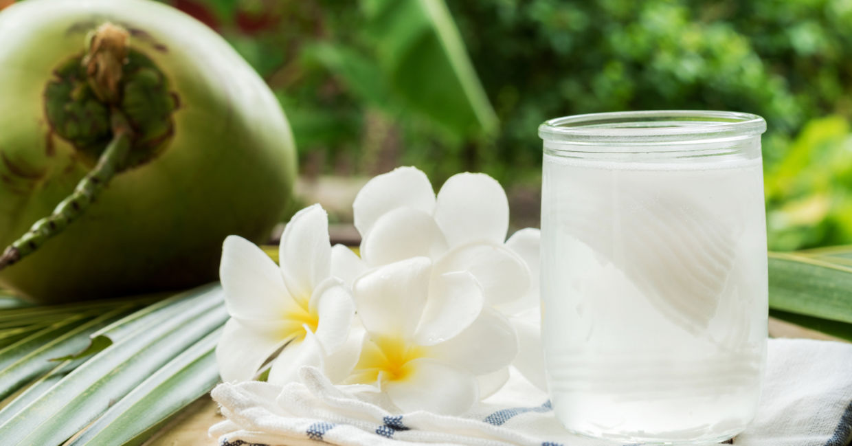 Fresh coconut water with flowers to represent a clear complexion..