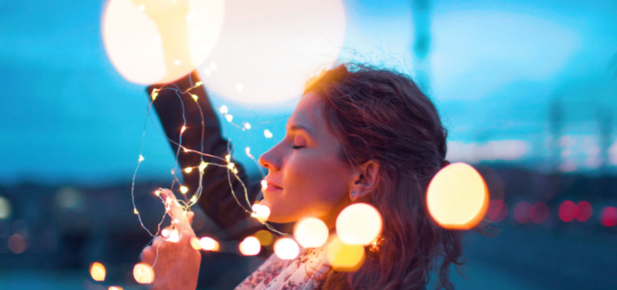 Woman holding fairy lights