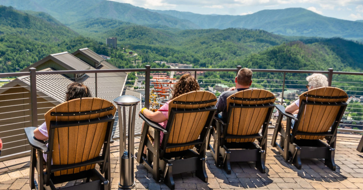 A family enjoys a view of Great Smoky Mountain from the Skydeck in Gatlinburg, Tennessee.