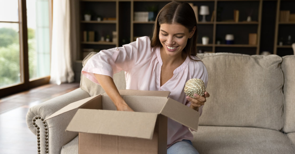 Opening a box with products.