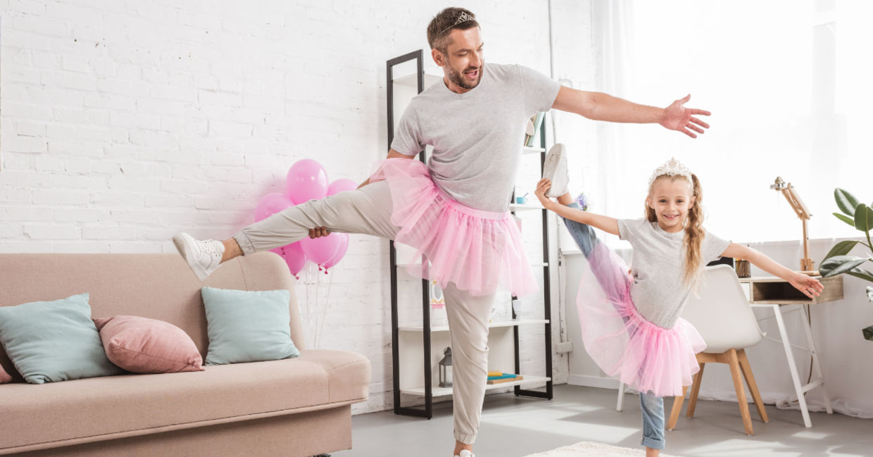 Father and daughter in pink tutu skirts.