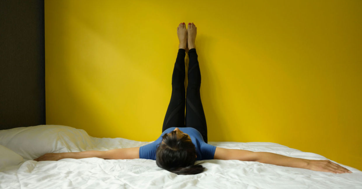 Stretch with the legs up the wall pose.