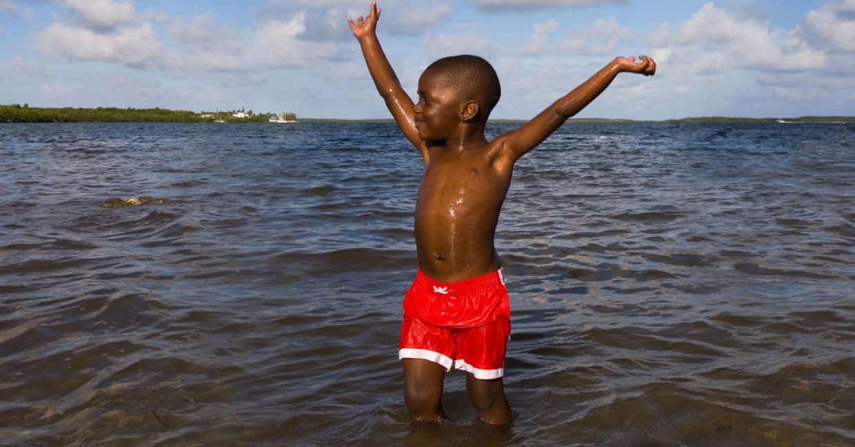 a boy's first time in the ocean.