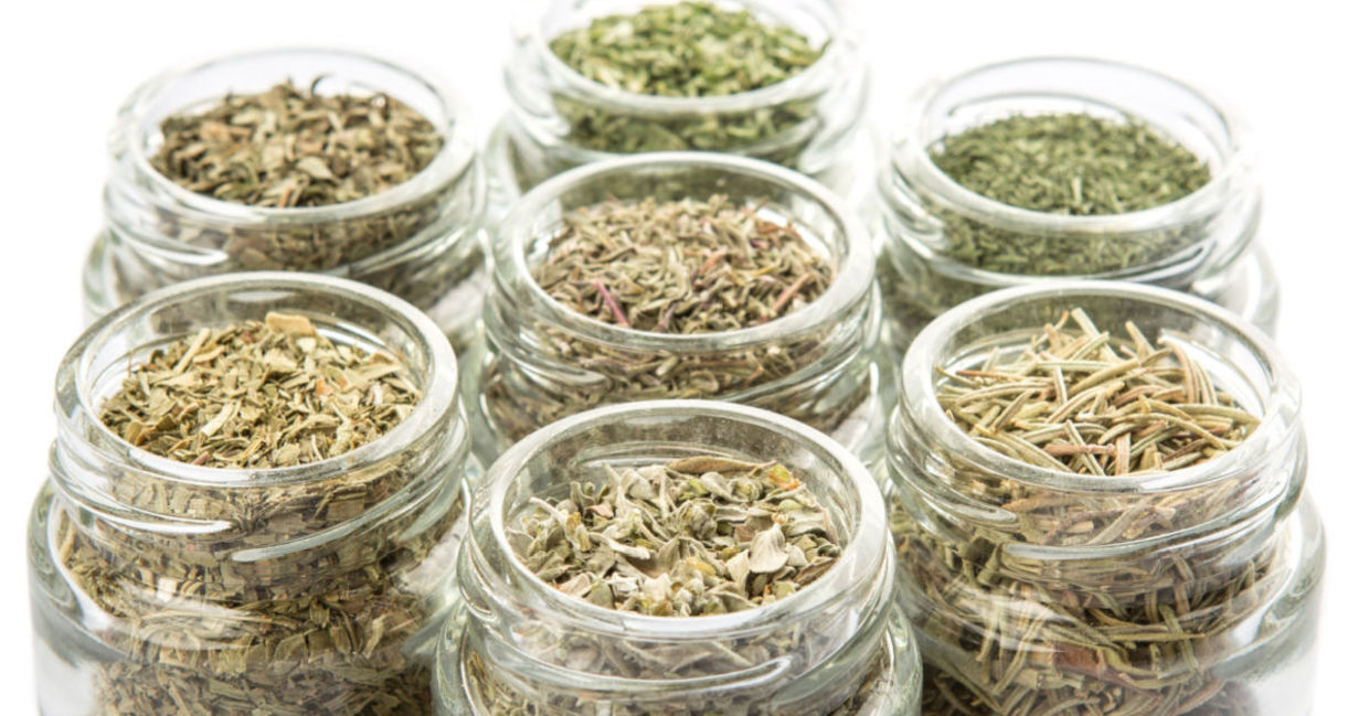 Herbs stored in small jars.