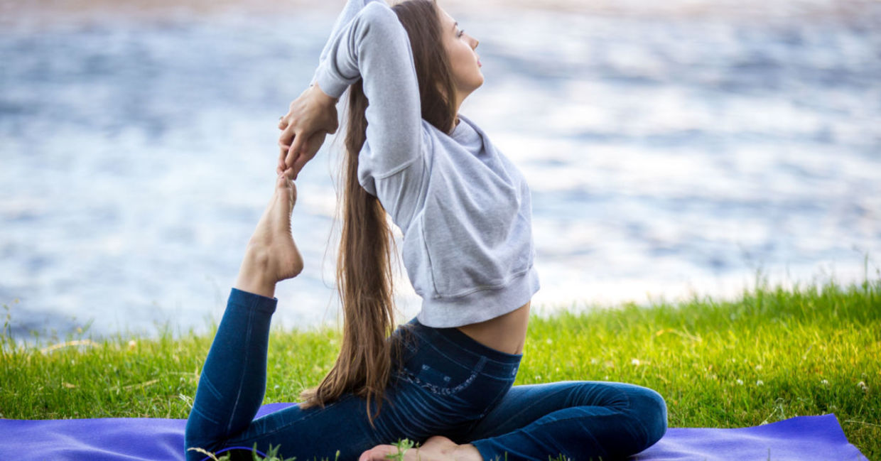 A woman grounding herself with the pigeon pose.