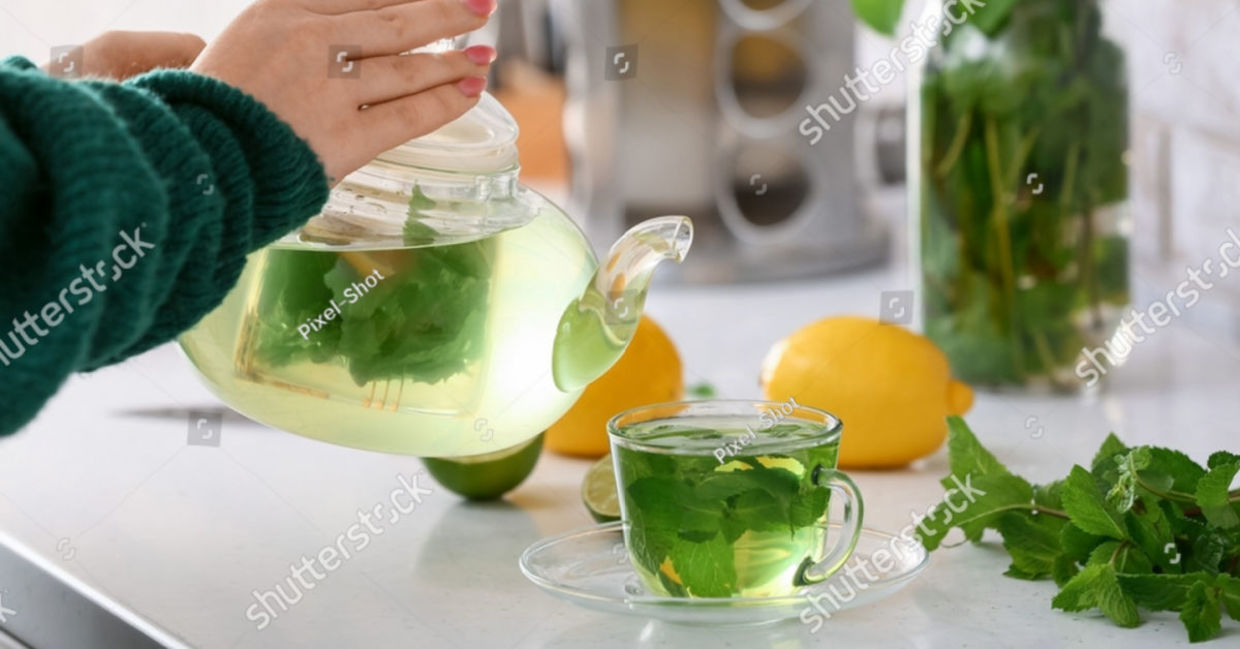 Woman pouring  green tea.