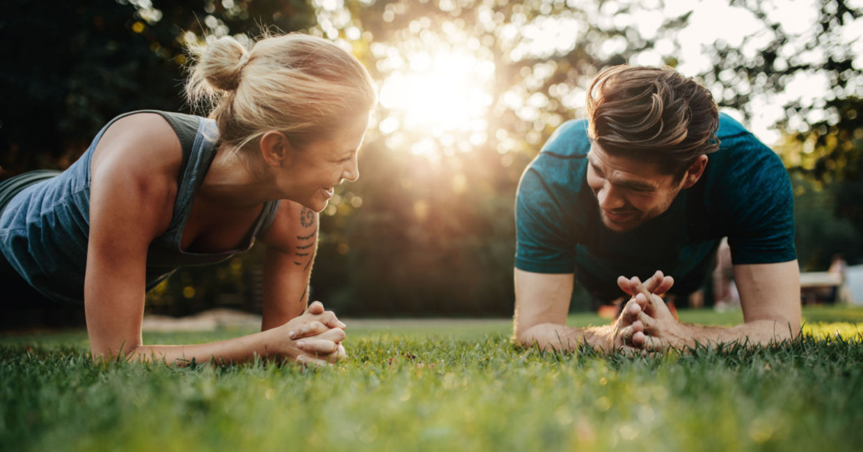 Couple exercising in their backyard.