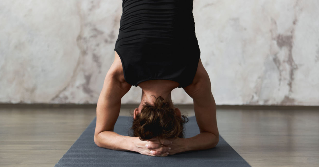 Woman in the headstand yoga  pose.