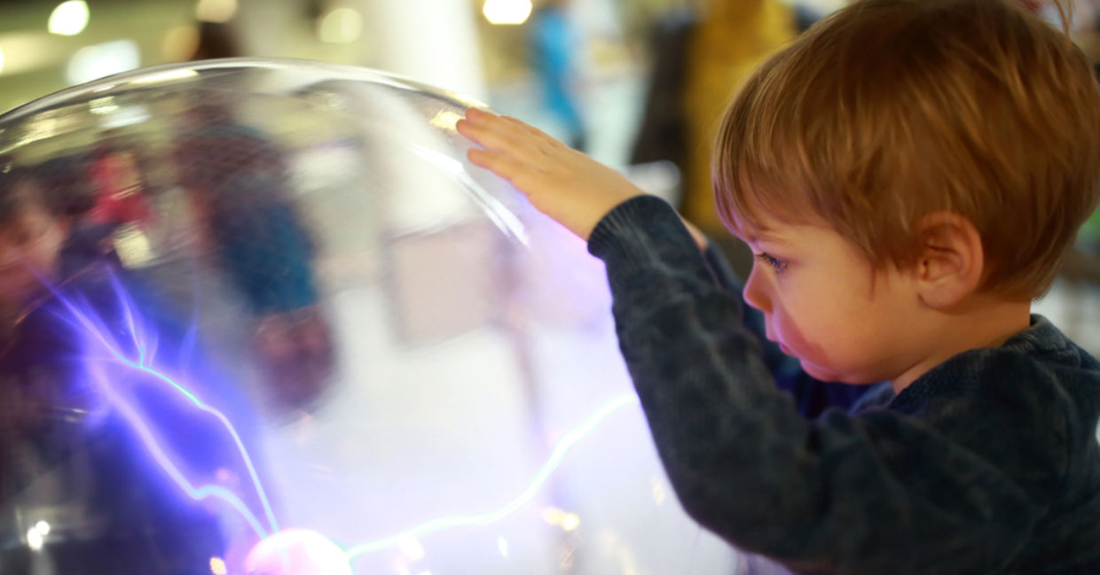 A young child studying science.