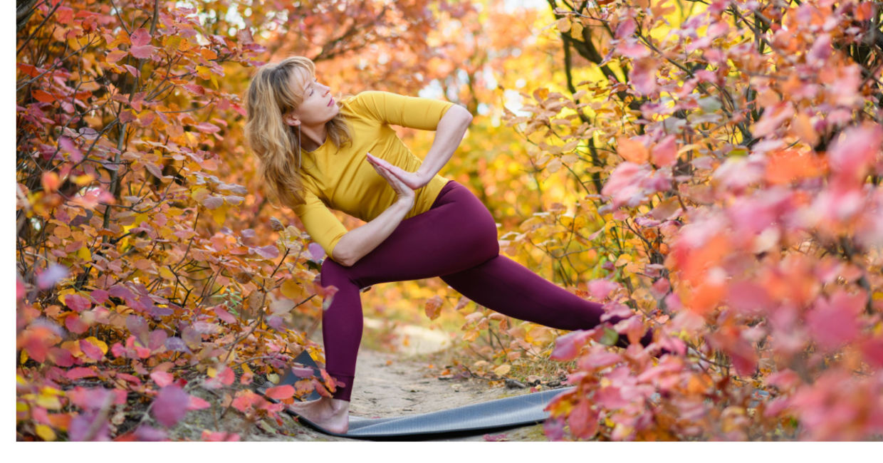 Practicing yoga amongst the autumn leaves. (O_Lypa / Shutterstock.com)