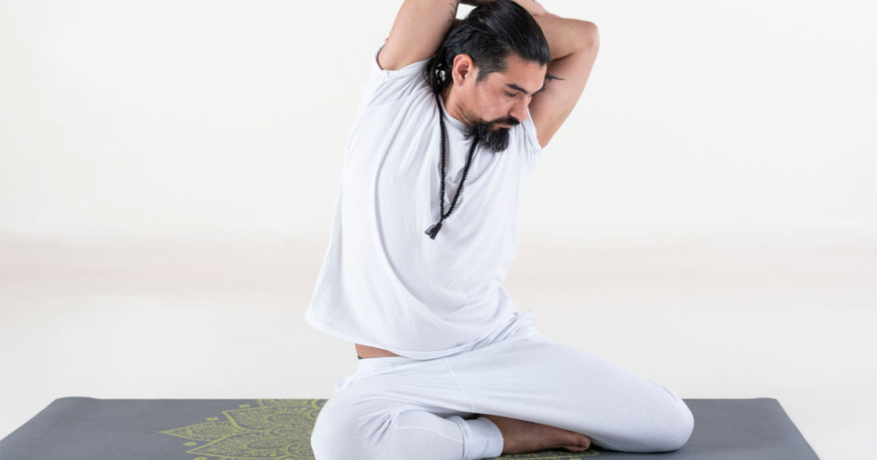 Entering the bharadvaja's twist yoga pose.