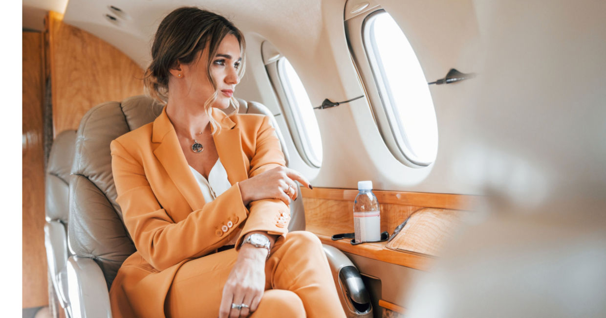 A relaxed woman flying in business class.