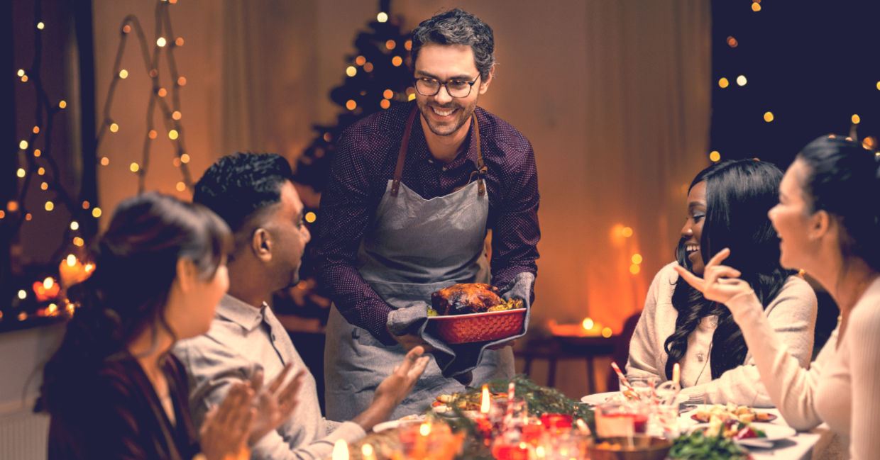 Friends enjoying Christmas dinner together.