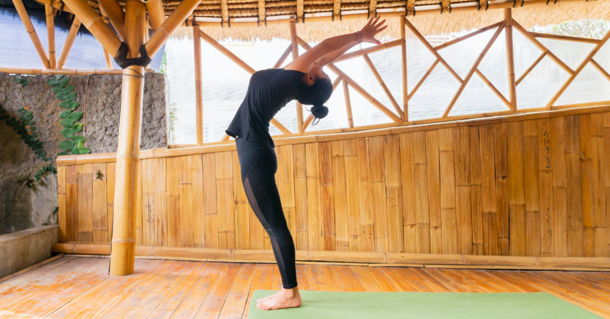 Woman in the crescent moon pose.