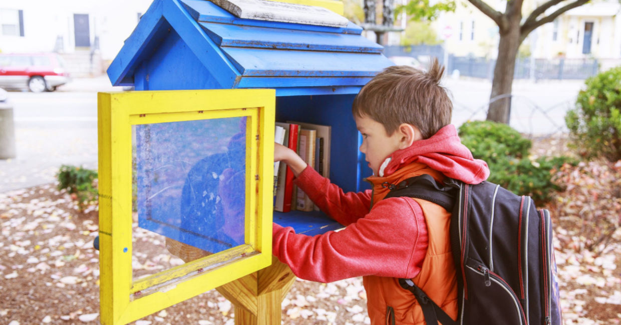 Bringing books to a Little Free Library.