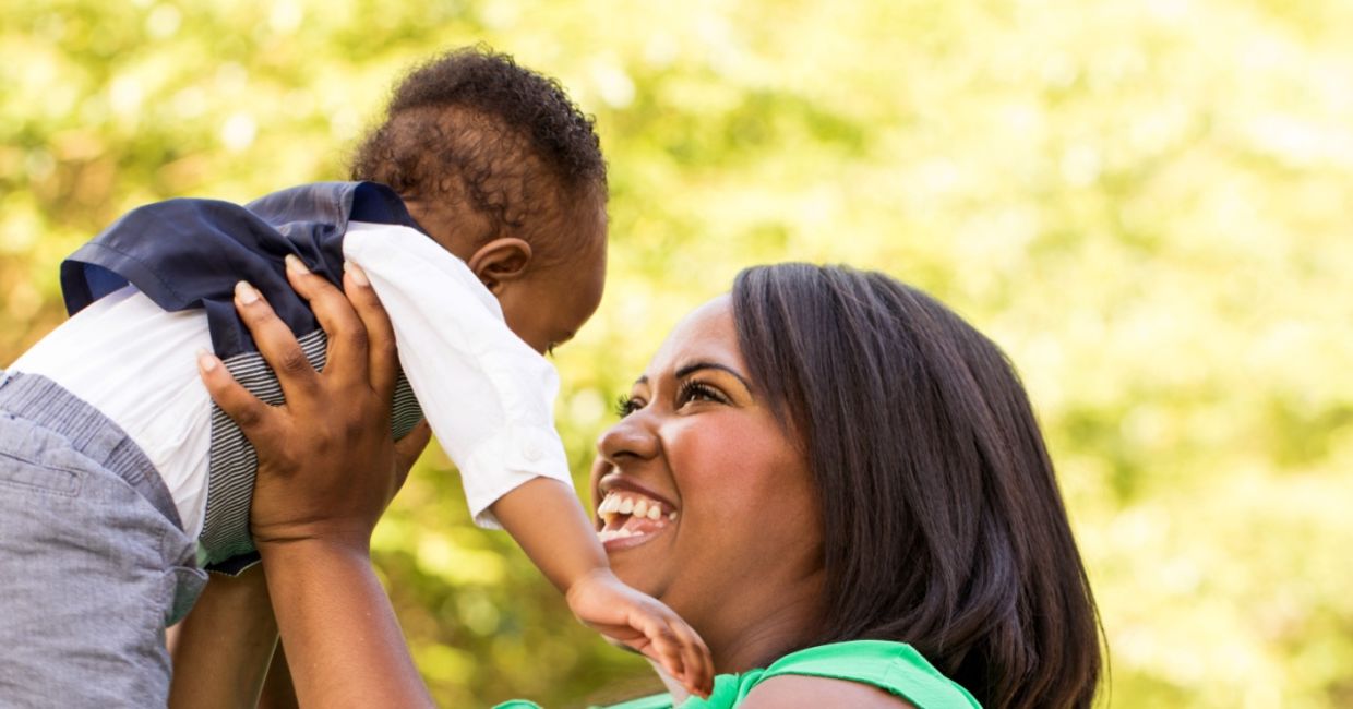 Baby boy babbling to mom.