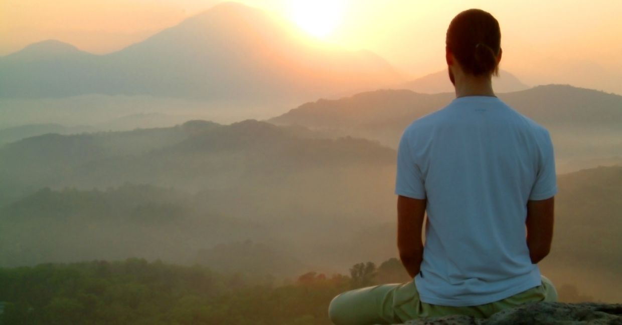 A man performing mindful meditation.