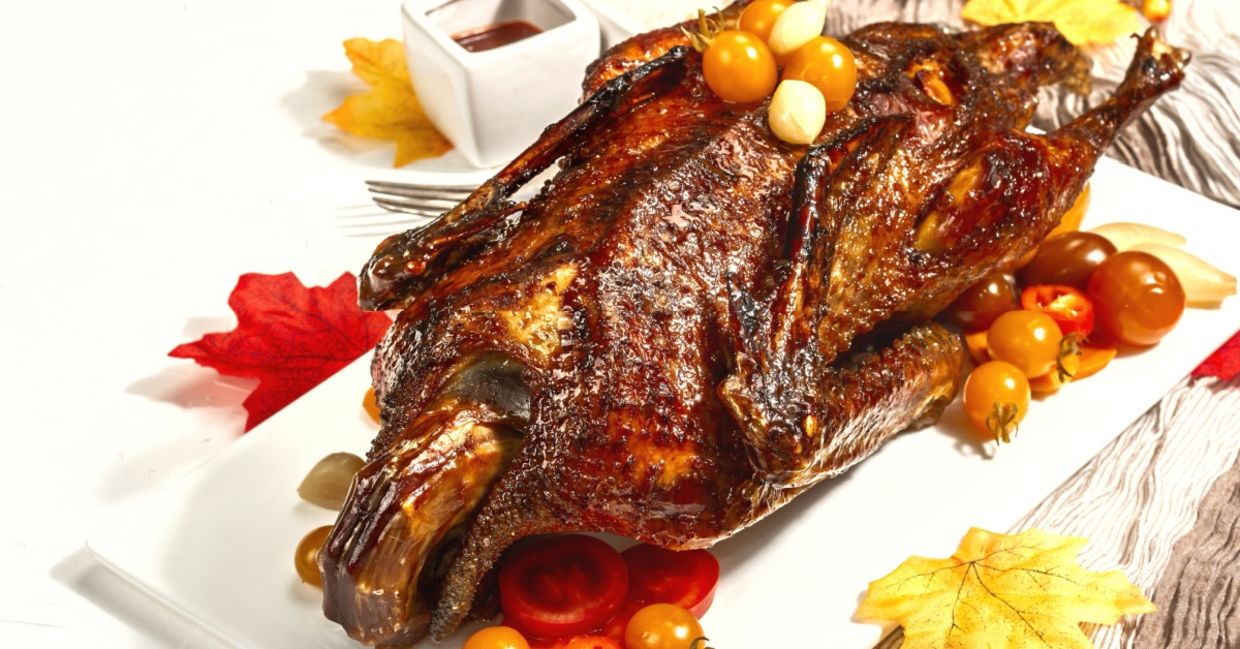 Serve a roasted duck for an authentic Thanksgiving experience.