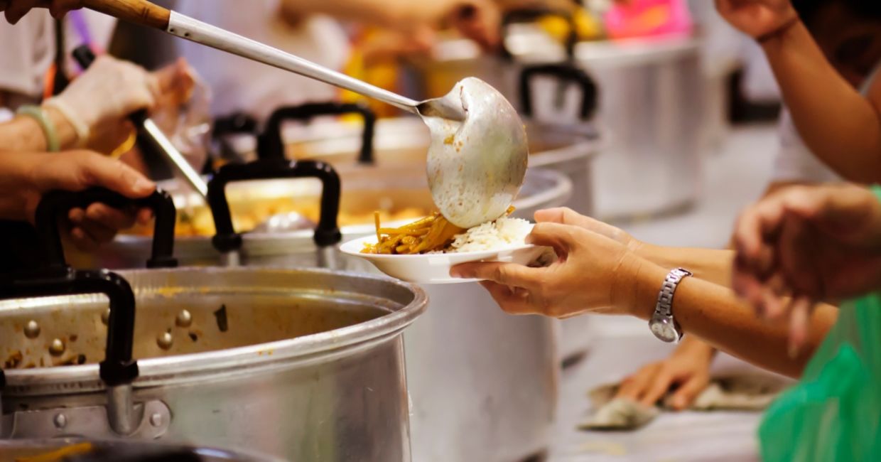 Helping at a soup kitchen.