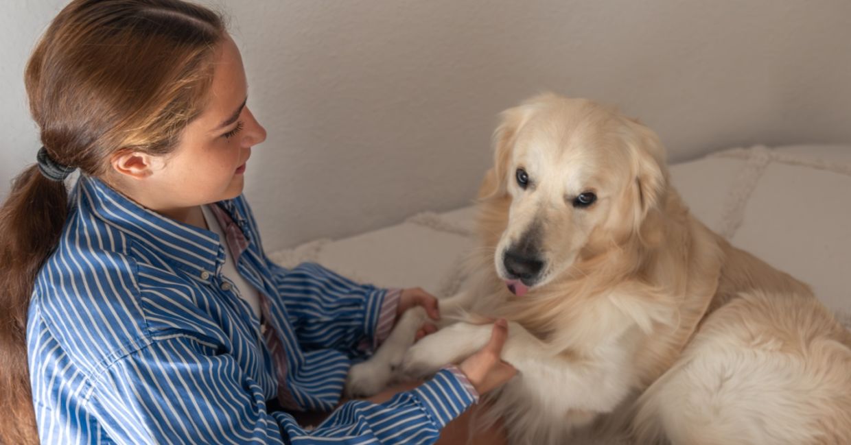 A teenage girl with her pet dog.