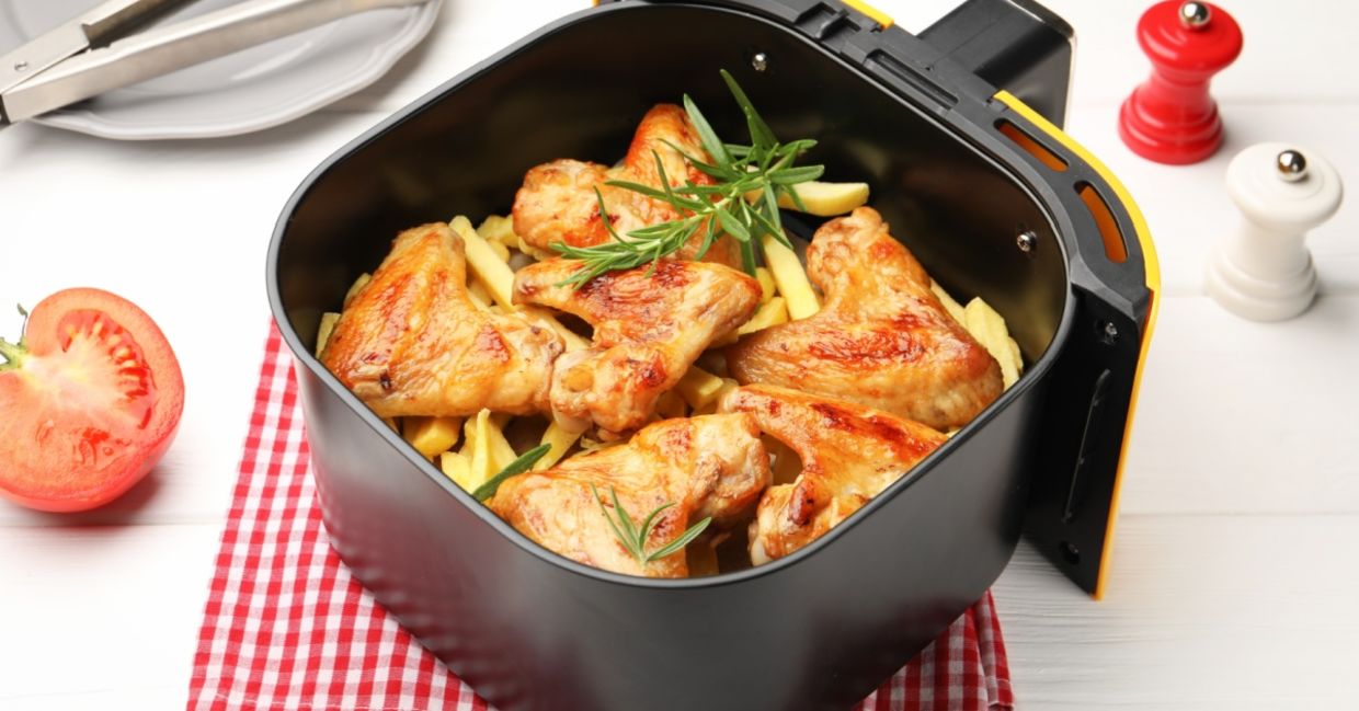 Cooking chicken wings in an air fryer.