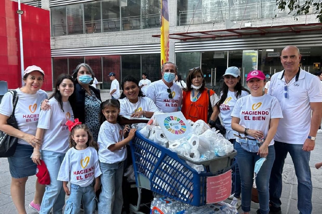 Volunteers gather with supplies during a Good Deeds Day community activity in Mexico.