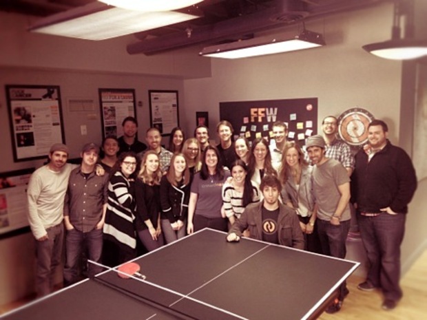 The CrowdRise team around the office's ping pong table