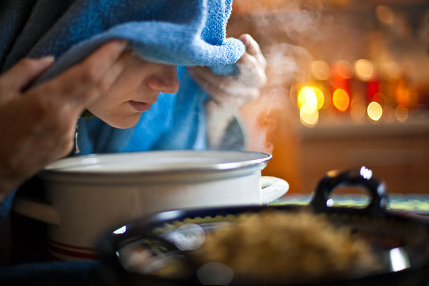 Face above a pot filled steamed water to open pores