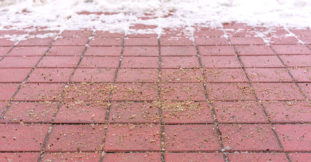 ground coffee on floor to melt snow and ice