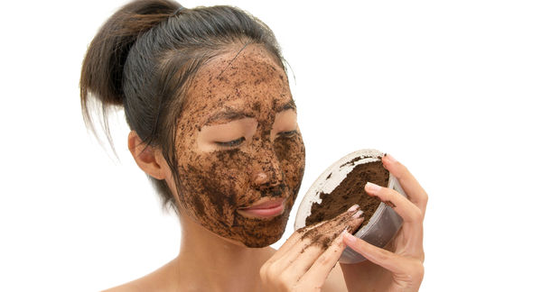 woman using scrub made from coffee beans