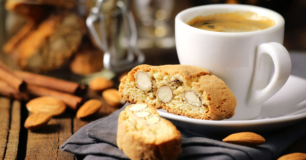 Frothy Frothy Italian espresso coffee with Italian almond biscuits.