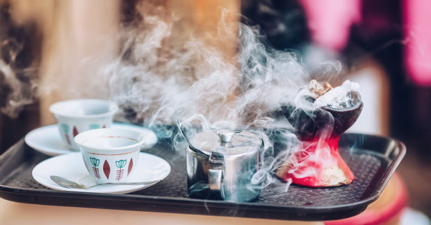 Traditional Traditional cup of Ethiopian coffee served with aromatic essence held to ward off bad spirits.