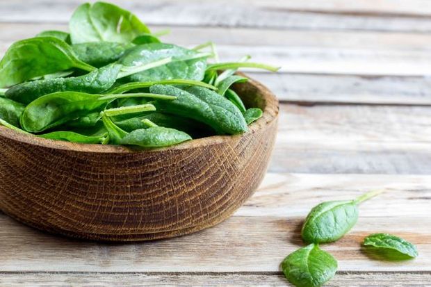 A bowl of spinach.