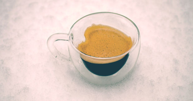 Espresso Espresso coffee in a heart-shaped cup to illustrate its health benefits.