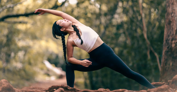 Woman Woman in the extended side angle yoga pose.